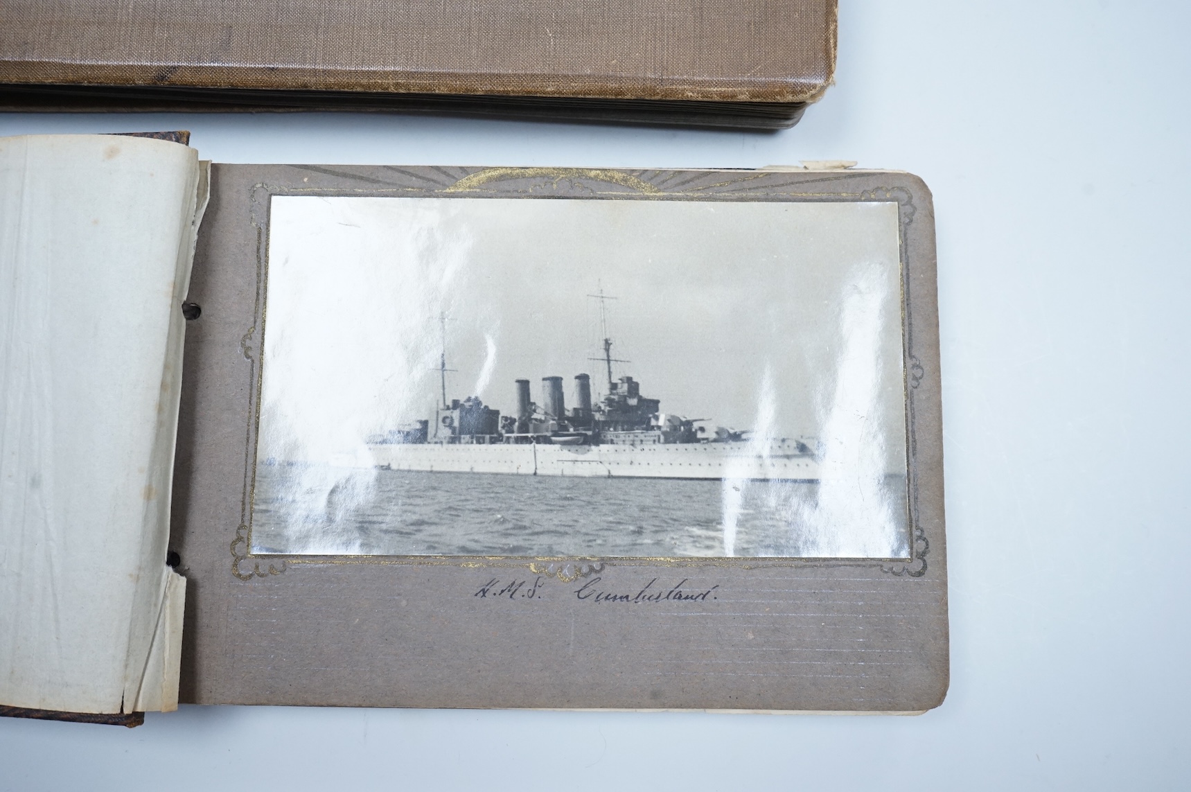 Two WWII naval photo albums, containing an archive of 1940s photographs of the Russian convoy in the Barents Sea, a ship’s concert at Scarpa Flow, a variety of Royal Naval vessels and some aircraft, images aboard HMS Peg